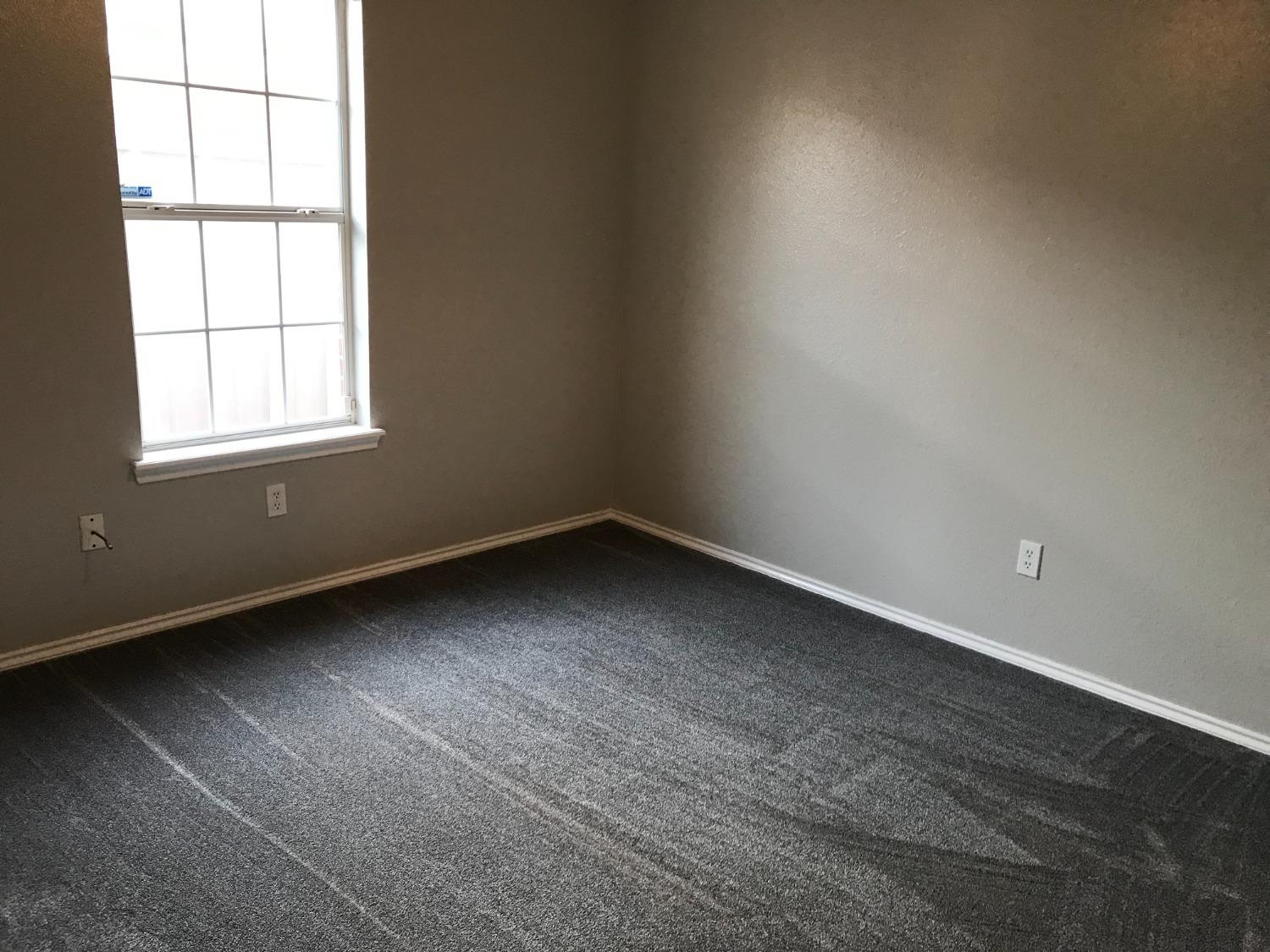 6201 5th Street Lubbock, TX 79416 - Photo 24 of 32 an empty room with a window
