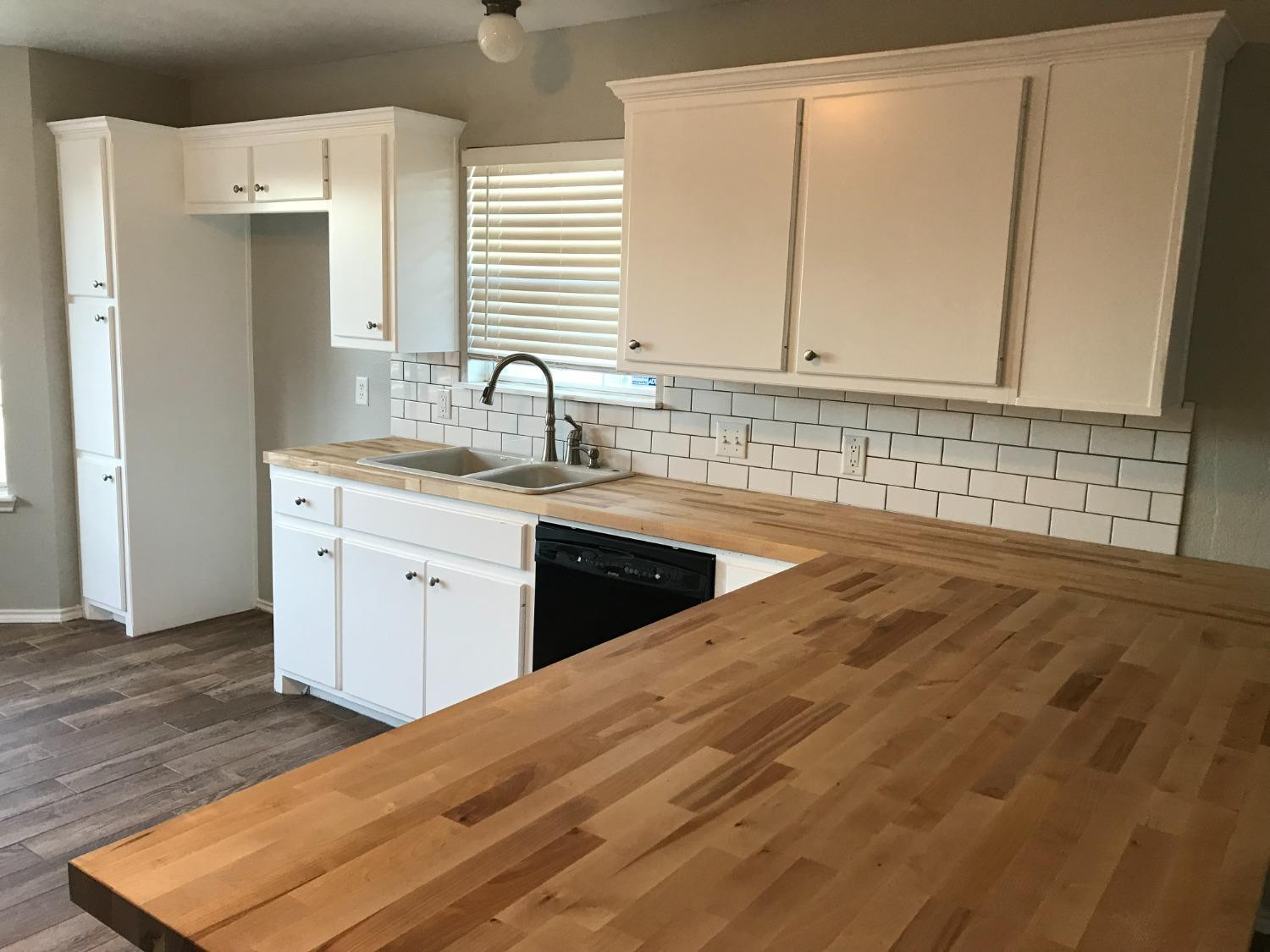 6201 5th Street Lubbock, TX 79416 - Photo 3 of 32 a view of a kitchen with a sink