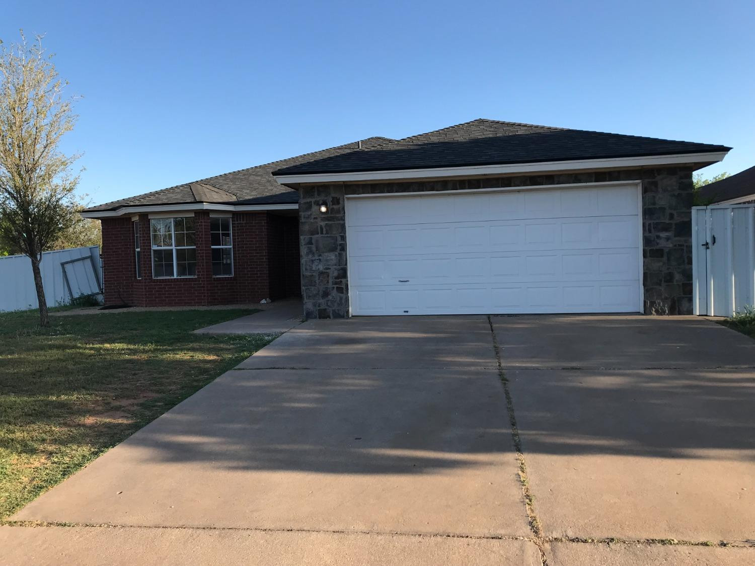 6201 5th Street Lubbock, TX 79416 - Photo 32 of 32 a front view of a house with a yard