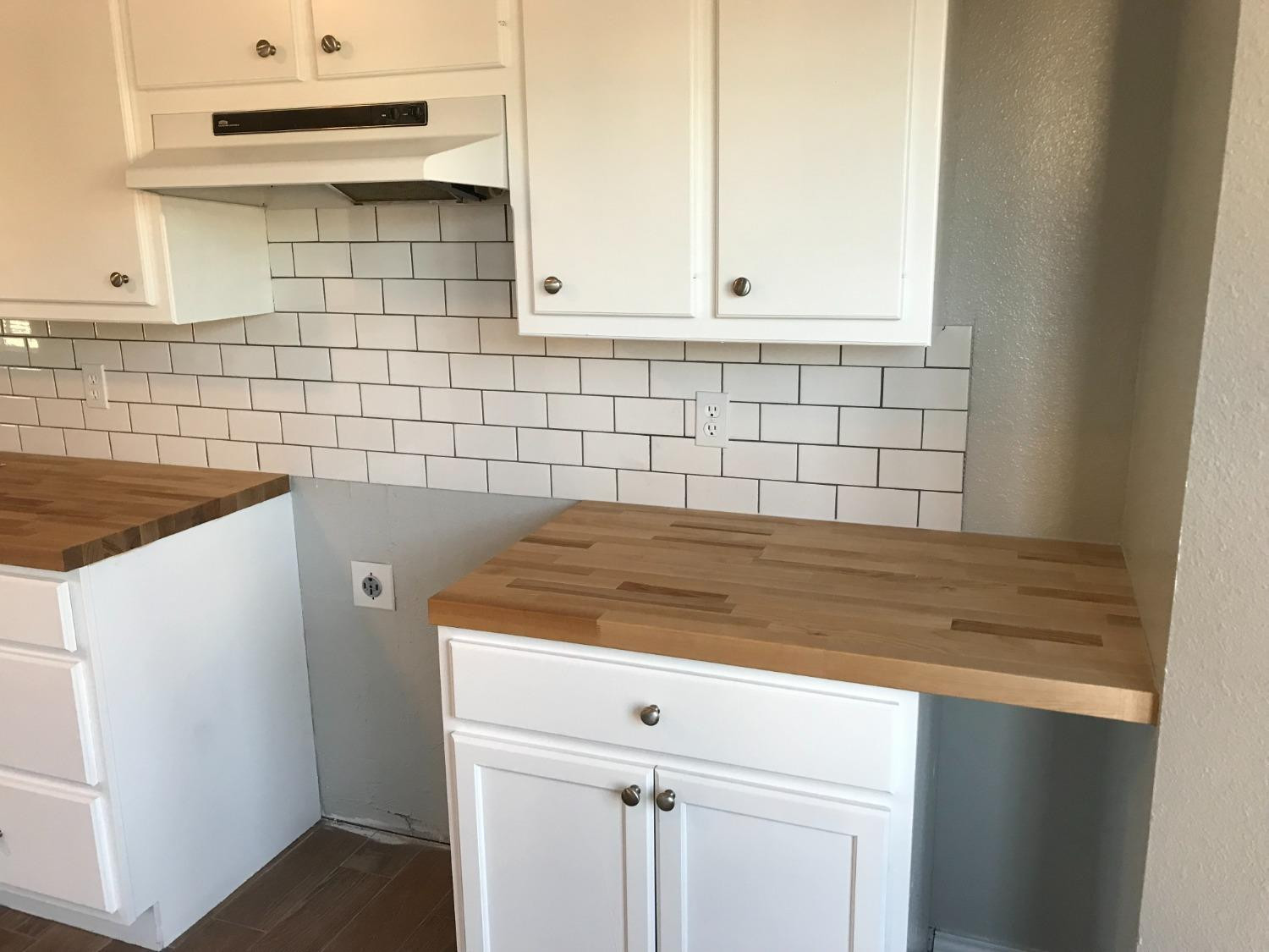 6201 5th Street Lubbock, TX 79416 - Photo 8 of 32 a kitchen with a sink and cabinets