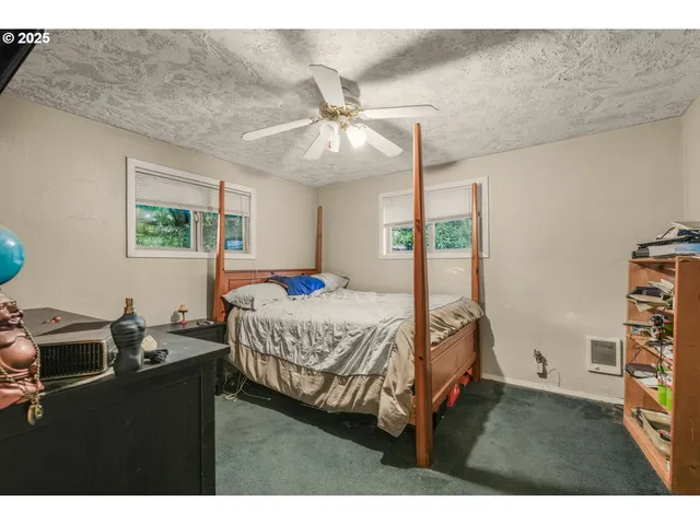 a bathroom with a sink toilet vanity and shower