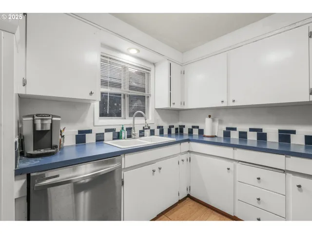 a kitchen with stainless steel appliances granite countertop a refrigerator stove and microwave