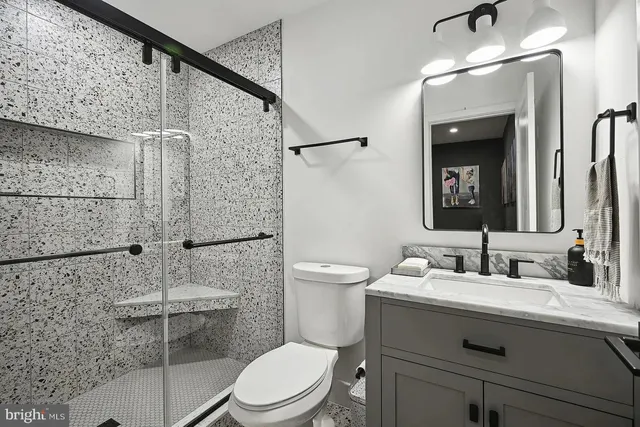 a living room with a cabinets and a window