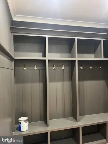 a living room with furniture gym equipment and a window