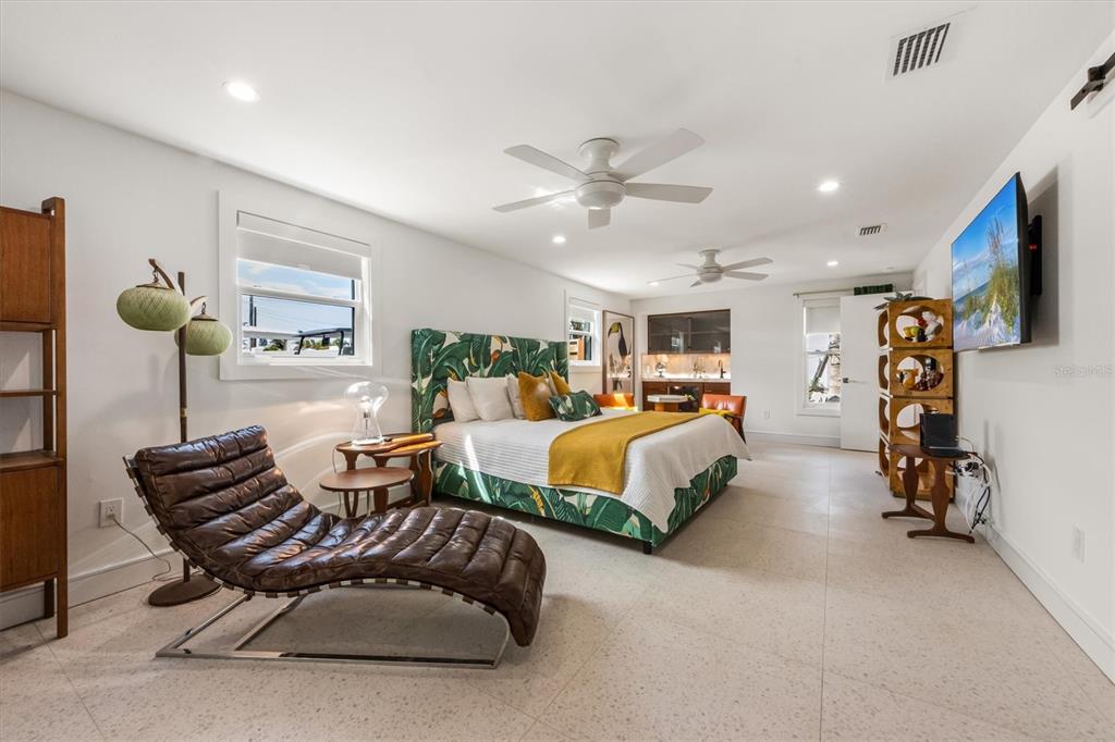 505 65th Street Holmes Beach, FL 34217 - Photo 20 of 64 a bedroom with furniture and a flat screen tv