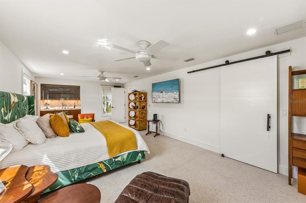 505 65th Street Holmes Beach, FL 34217 - Photo 21 of 64 a bedroom with a bed couch and window