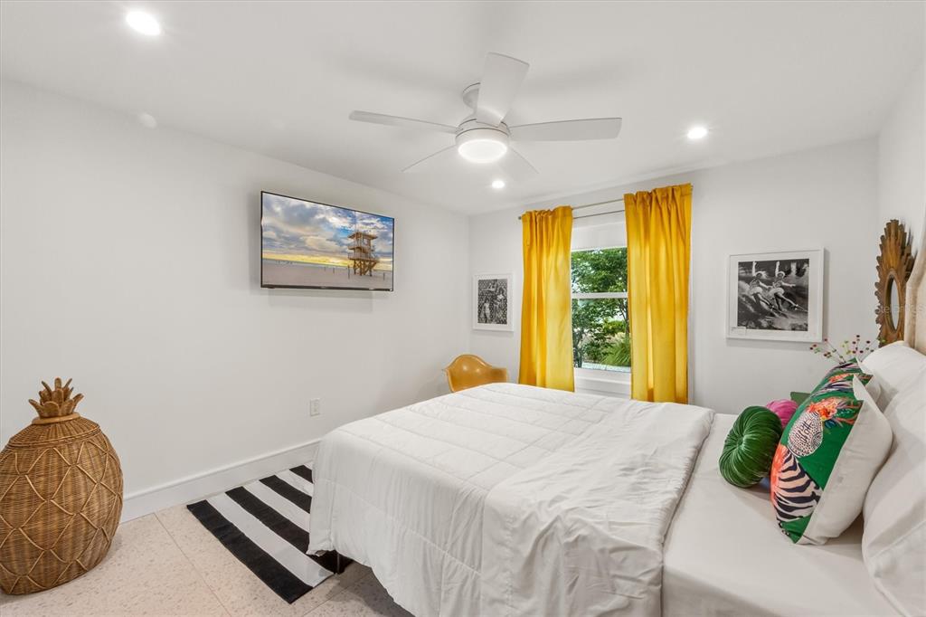 505 65th Street Holmes Beach, FL 34217 - Photo 29 of 64 a bedroom with a bed and a dresser