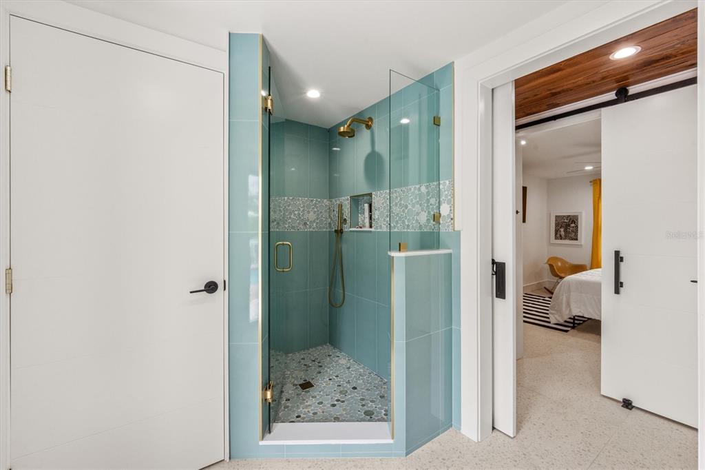 505 65th Street Holmes Beach, FL 34217 - Photo 32 of 64 a bathroom with a shower and a sink