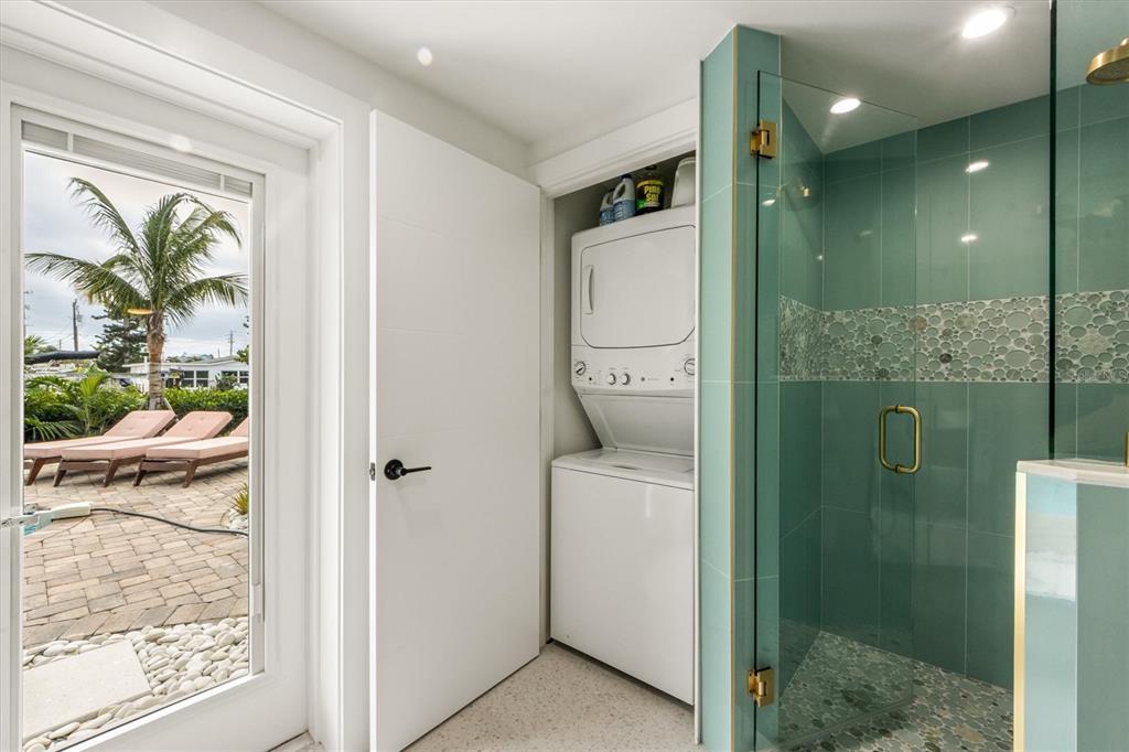 505 65th Street Holmes Beach, FL 34217 - Photo 36 of 64 a bathroom with a shower and a sink