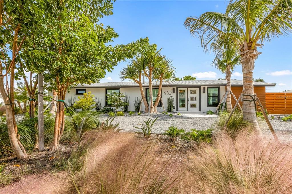 505 65th Street Holmes Beach, FL 34217 - Photo 4 of 64 a view of a house with a patio