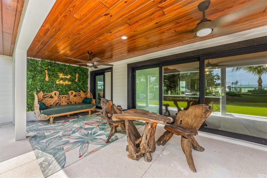 505 65th Street Holmes Beach, FL 34217 - Photo 44 of 64 a room with furniture and a large window