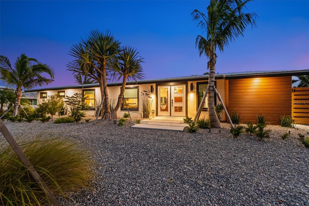 505 65th Street Holmes Beach, FL 34217 - Photo 52 of 64 a view of a house with a patio