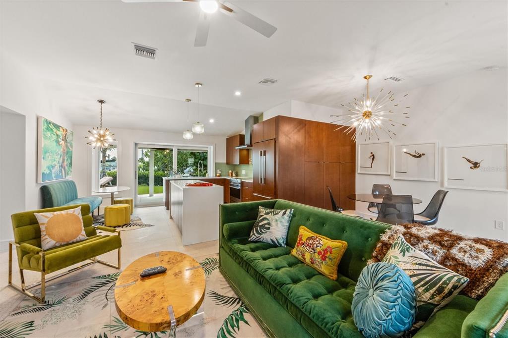 505 65th Street Holmes Beach, FL 34217 - Photo 10 of 64 a living room with furniture and a chandelier
