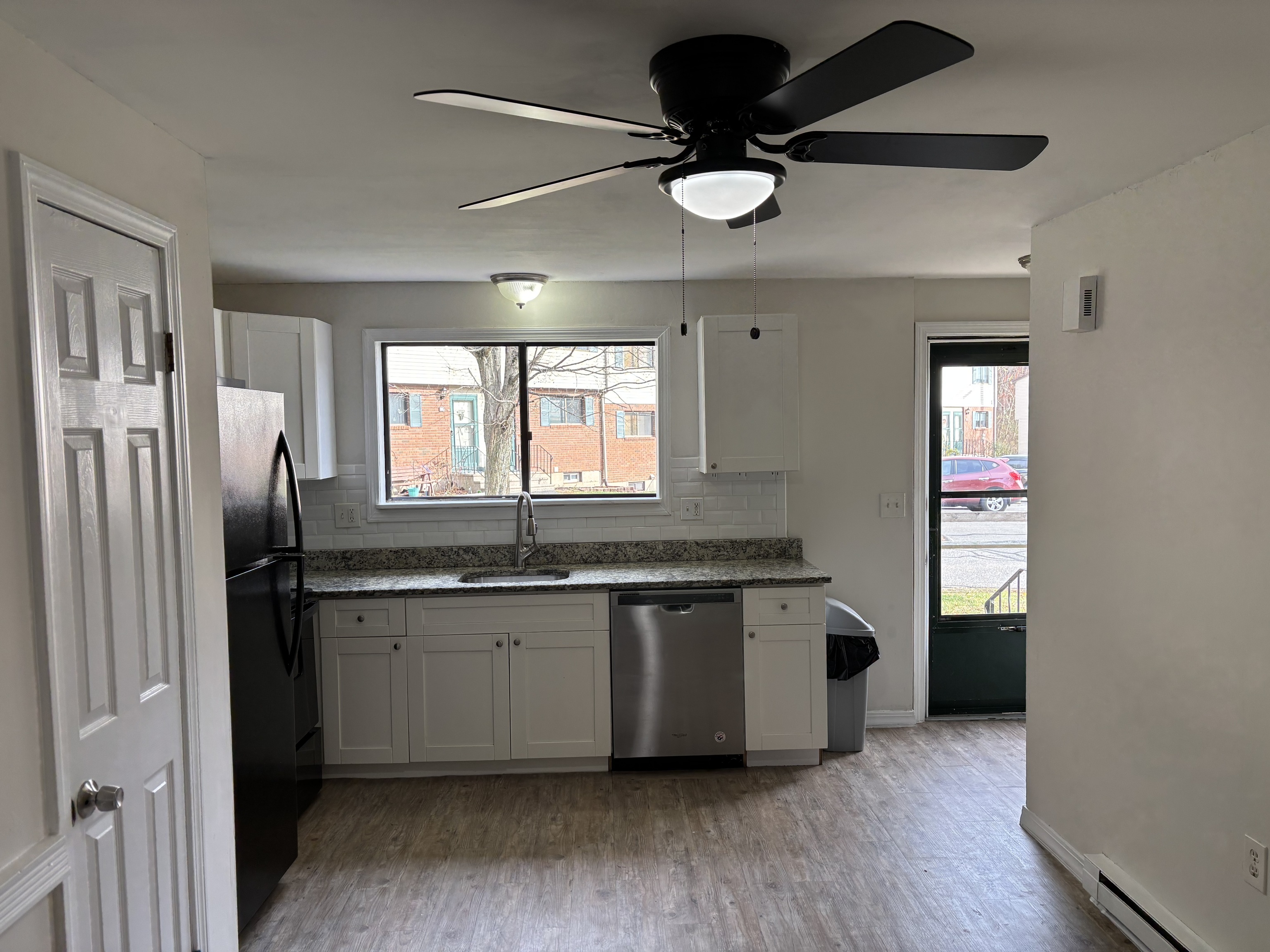 39 Horton Hill Road, Unit 9B Naugatuck, CT 06770 - Photo 2 of 10 a kitchen with stainless steel appliances granite countertop a sink and a refrigerator