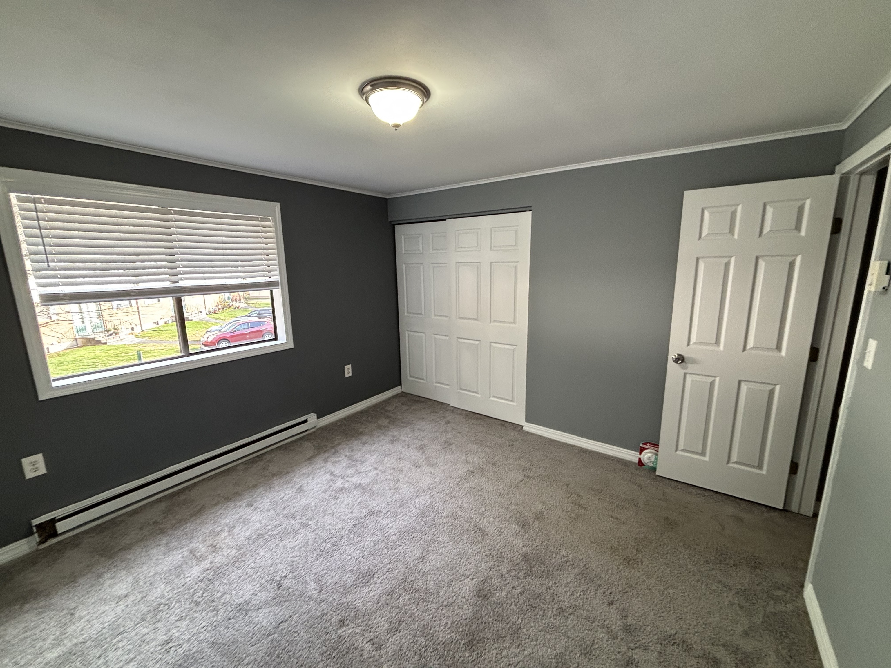 39 Horton Hill Road, Unit 9B Naugatuck, CT 06770 - Photo 7 of 10 an empty room with windows