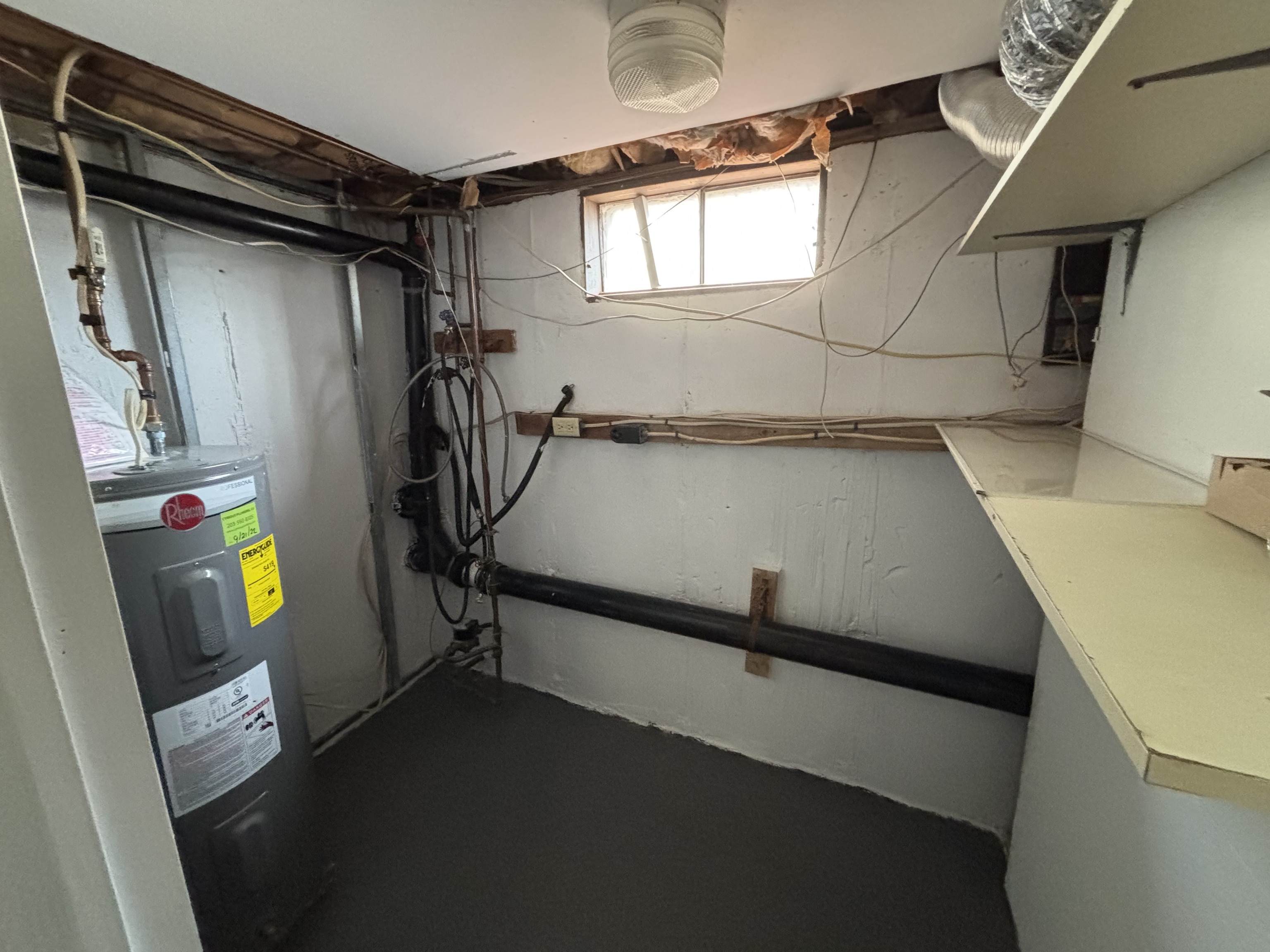 39 Horton Hill Road, Unit 9B Naugatuck, CT 06770 - Photo 10 of 10 a view of storage and utility room with a window