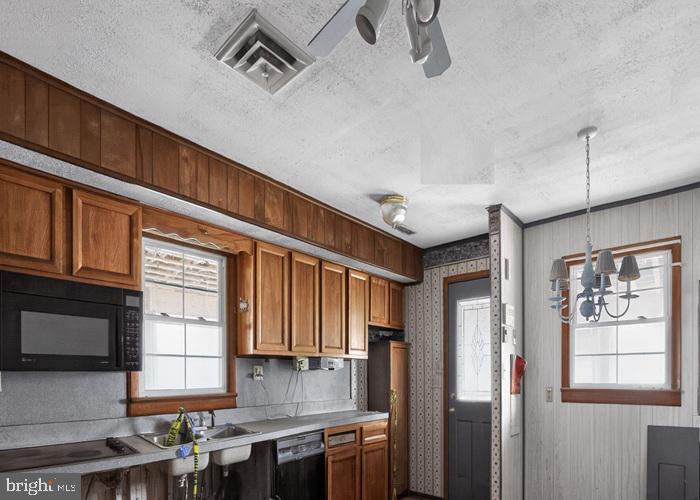 4802 Railroad Avenue Rhodesdale, MD 21659 - Photo 11 of 18 a kitchen with stainless steel appliances granite countertop a refrigerator and a stove top oven