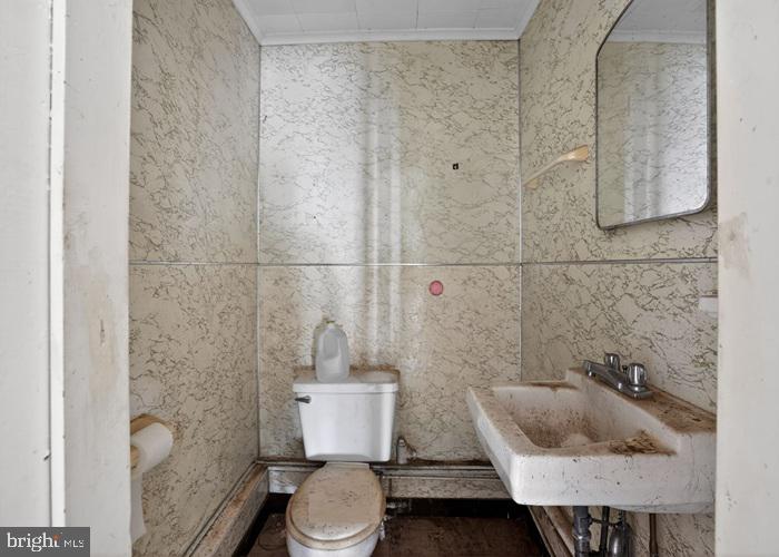 4802 Railroad Avenue Rhodesdale, MD 21659 - Photo 17 of 18 a bathroom with a toilet and a sink