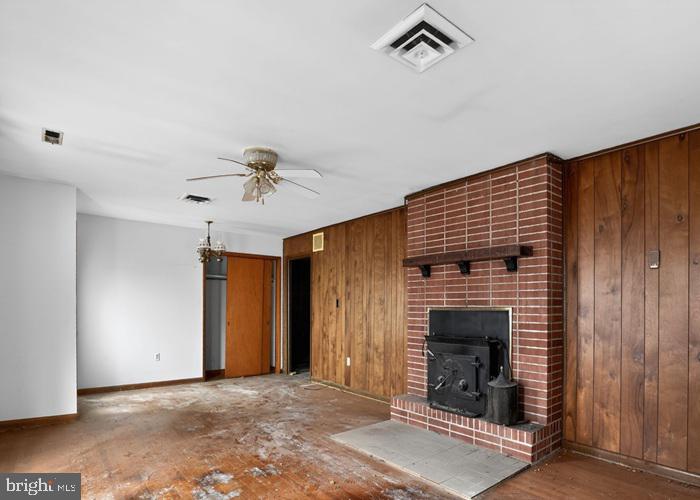 4802 Railroad Avenue Rhodesdale, MD 21659 - Photo 7 of 18 a view of an empty room with a fireplace and a window