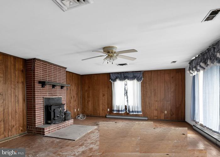 4802 Railroad Avenue Rhodesdale, MD 21659 - Photo 8 of 18 an empty room with windows and fireplace