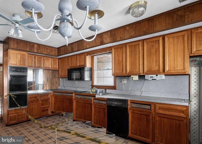 4802 Railroad Avenue Rhodesdale, MD 21659 - Photo 10 of 18 a kitchen with a sink cabinets and stainless steel appliances