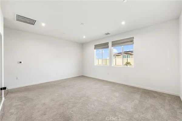a bathroom with a double vanity sink and mirror