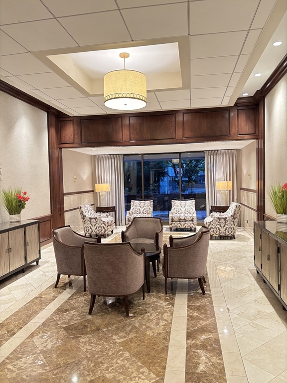 2 Hawthorne Place, Unit 7O Boston, MA 02114 - Photo 1 of 17 a living room with furniture and a potted plant
