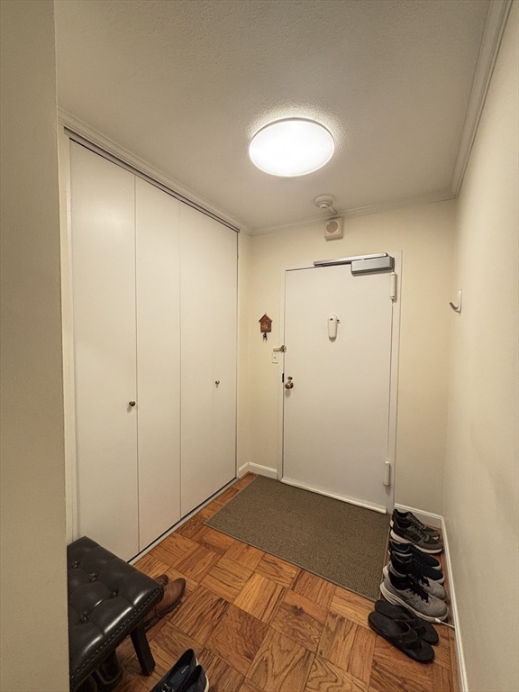 2 Hawthorne Place, Unit 7O Boston, MA 02114 - Photo 9 of 17 a bedroom with a bed and a dresser