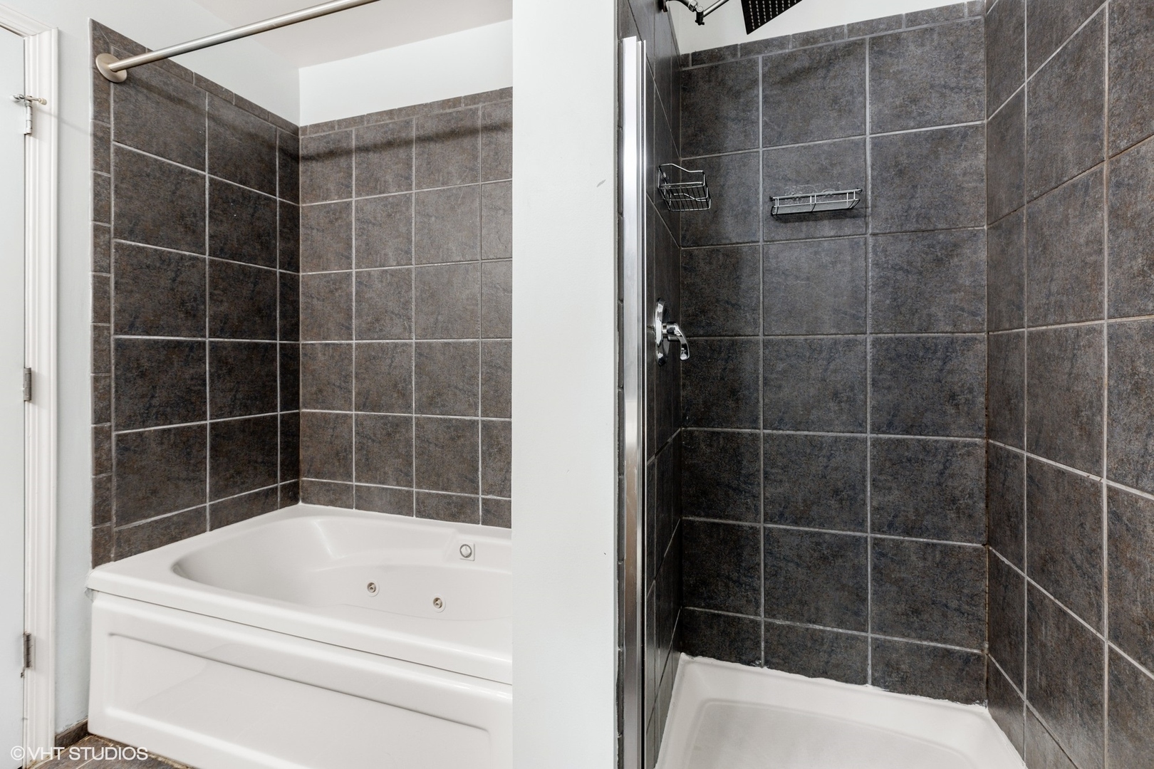 111 South Morgan Street, Unit 325 Chicago, IL 60607 - Photo 12 of 18 a bathroom with a bathtub and a shower