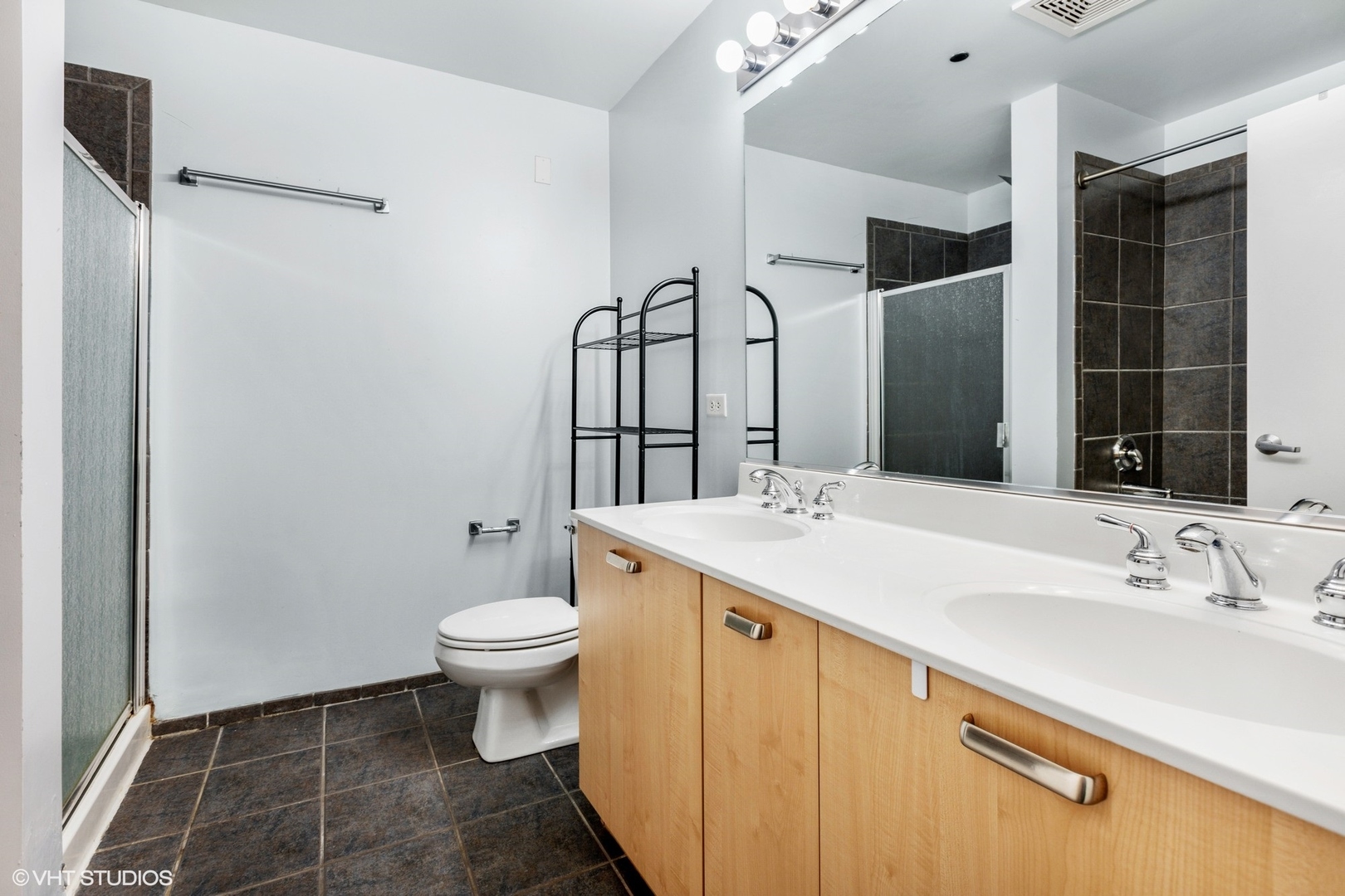 111 South Morgan Street, Unit 325 Chicago, IL 60607 - Photo 13 of 18 a bathroom with a sink toilet and shower