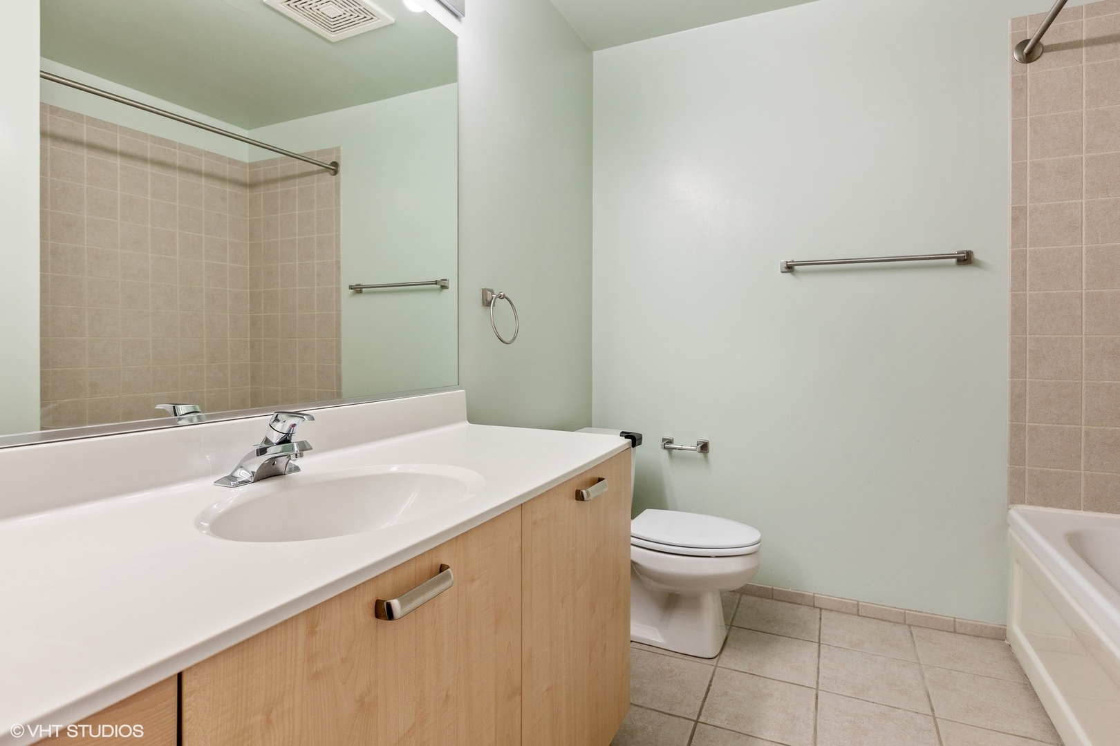 111 South Morgan Street, Unit 325 Chicago, IL 60607 - Photo 14 of 18 a bathroom with a sink toilet and a mirror