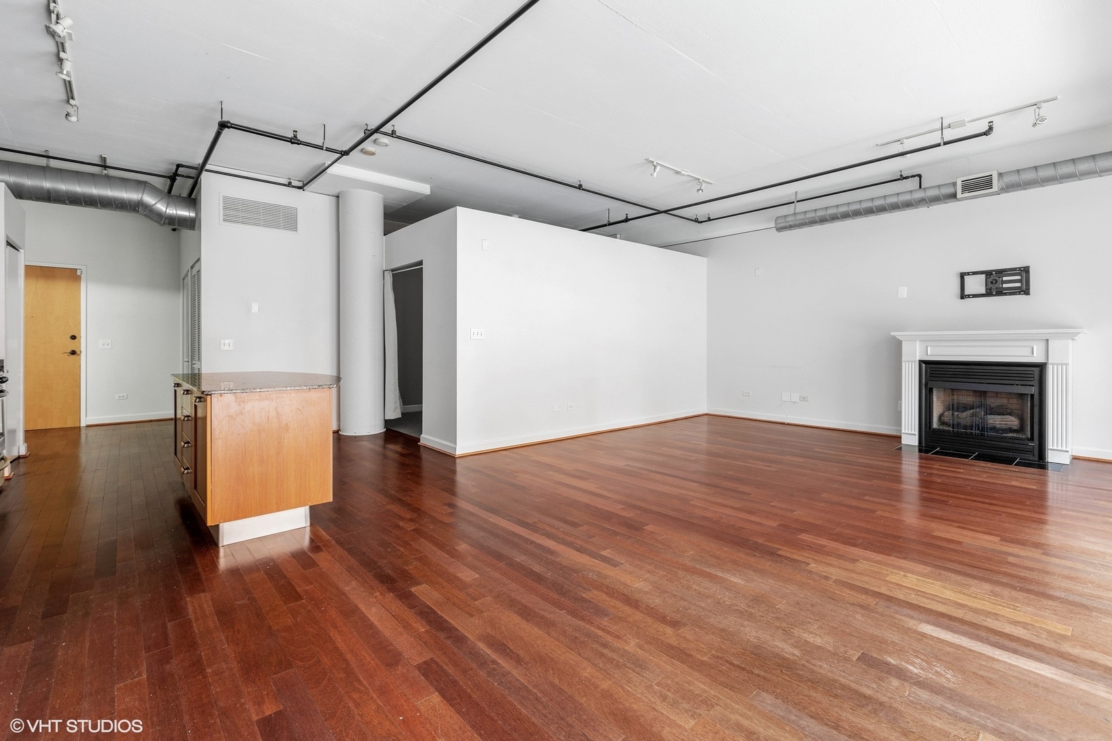 111 South Morgan Street, Unit 325 Chicago, IL 60607 - Photo 4 of 18 a view of a livingroom with wooden floor and a ceiling fan