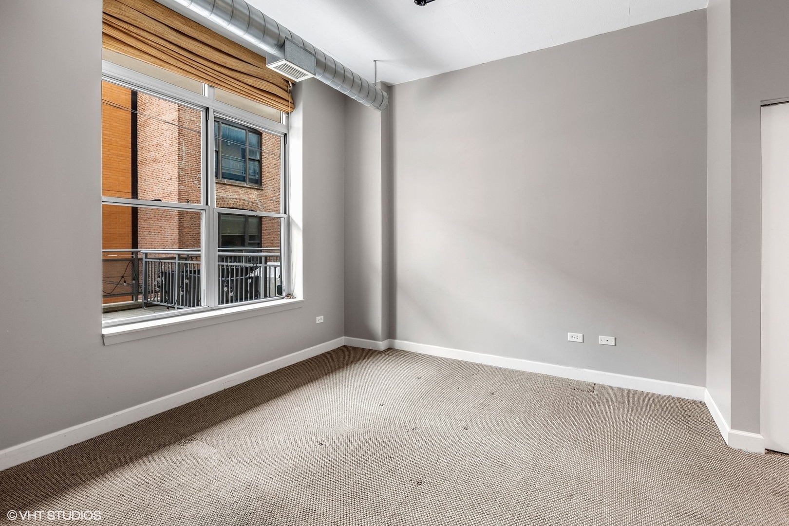111 South Morgan Street, Unit 325 Chicago, IL 60607 - Photo 10 of 18 a view of an empty room with a window