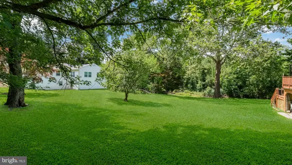 a view of field with trees in the background