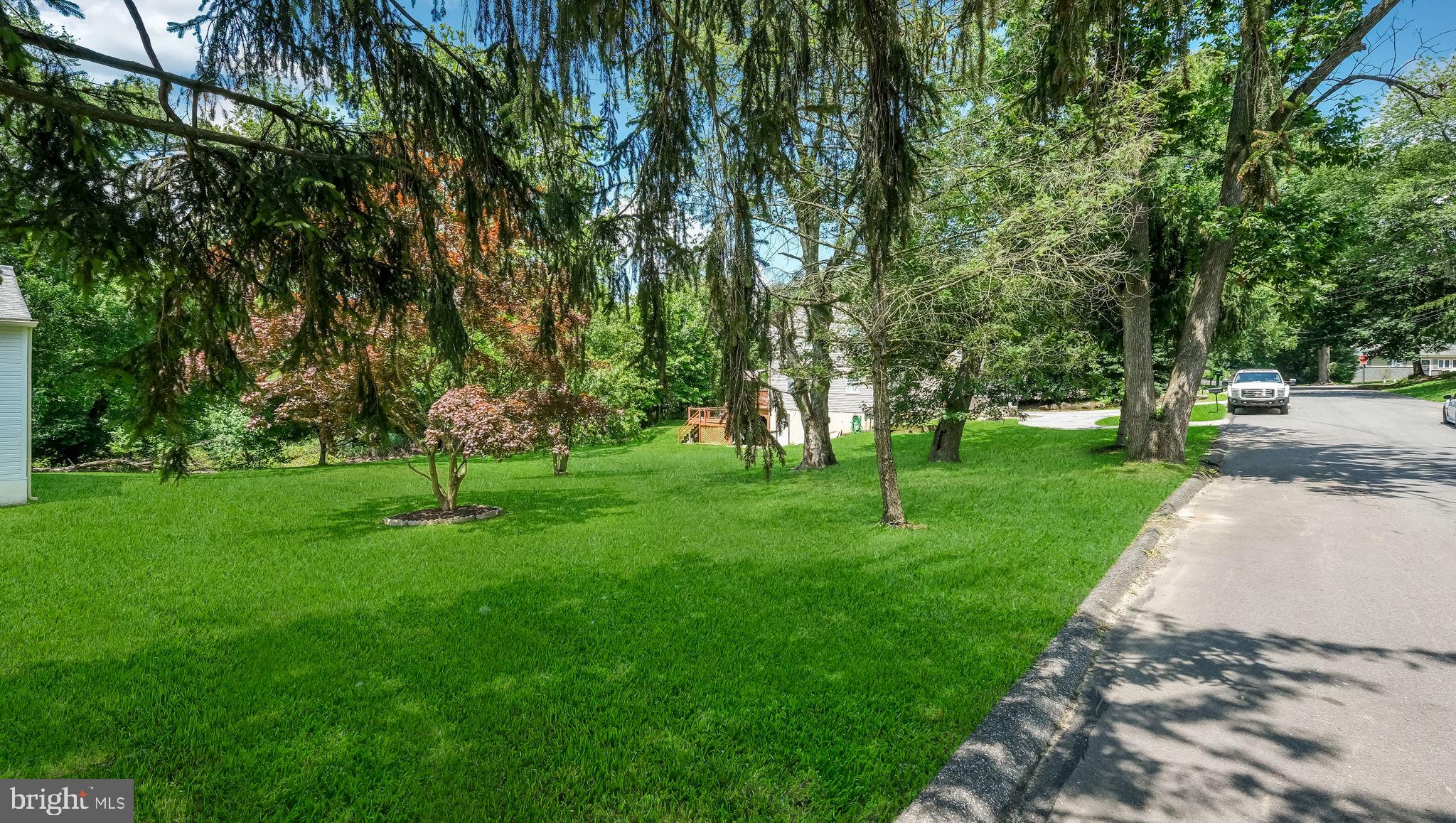 1813 Manor Avenue Marcus Hook, PA 19061 - Photo 2 of 13 a view of a park with a tree