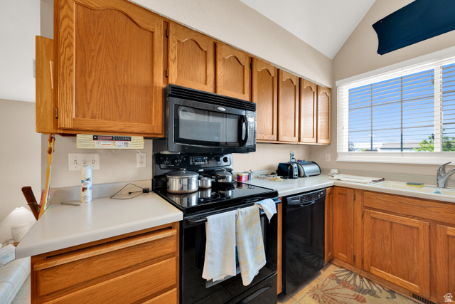 8029 Angel Street Sandy, UT 84070 - Photo 4 of 21 Kitchen featuring wood cabinetry, white countertops, black appliances, and a window with horizontal blinds