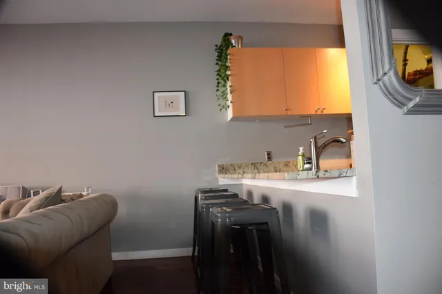 a room with a sink and a mirror