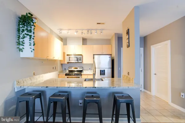 a kitchen with a table and chairs in it