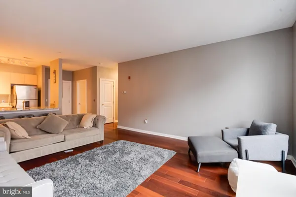 a living room with furniture and a rug