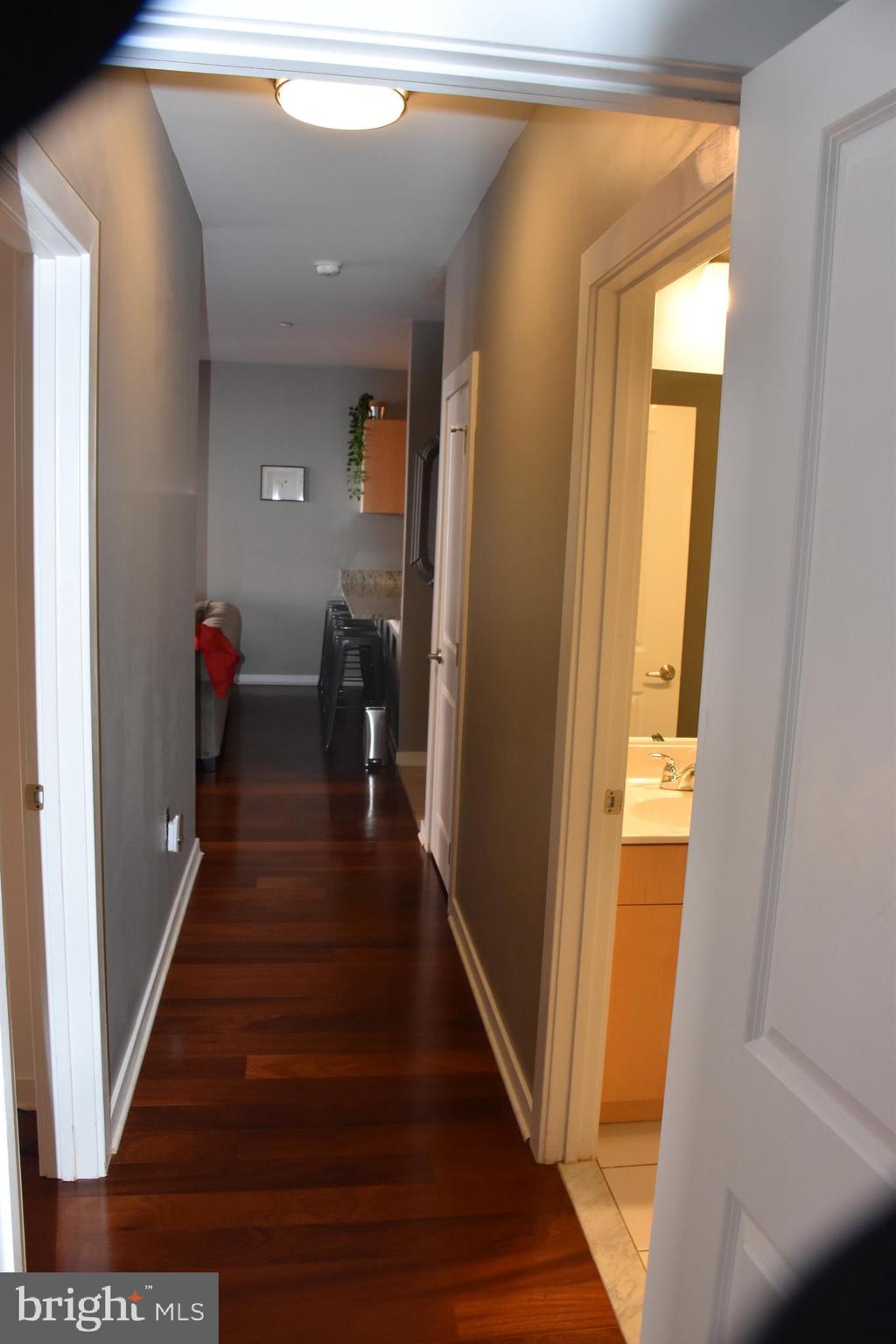 2007 Clipper Park Road, Unit 212 Baltimore, MD 21211 - Photo 24 of 33 a hallway with wooden floor and stairs