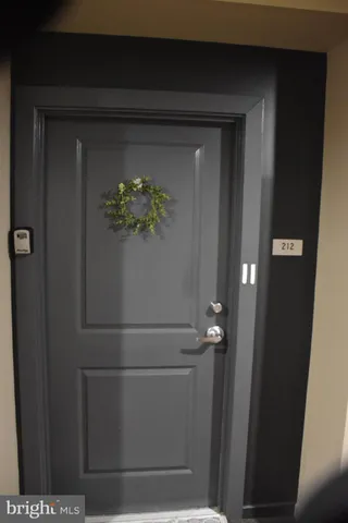 a view of a hallway with wooden shelves