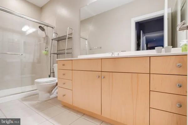 a bathroom with a toilet sink and shower