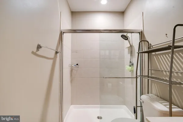a bathroom with a shower and a bath tub