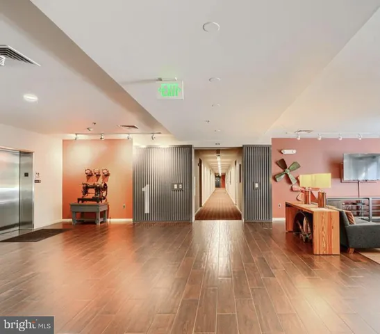 a view of a patio with table and chairs potted plants with wooden floor
