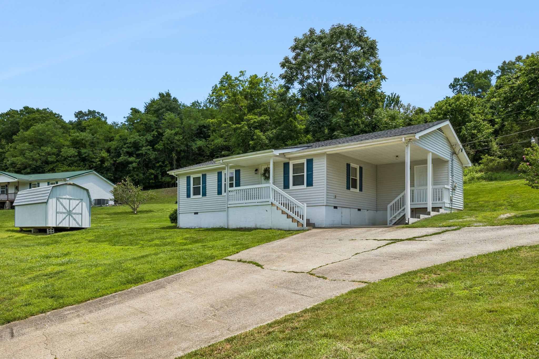14 Morris Lane Carthage, TN 37030 - Photo 2 of 31 a front view of a house with a garden and yard