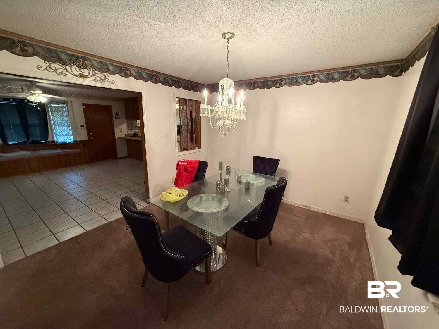 3721 Robertson Court Mobile, AL 36693 - Photo 7 of 22 Tiled dining room featuring a textured ceiling, carpet flooring, and a chandelier