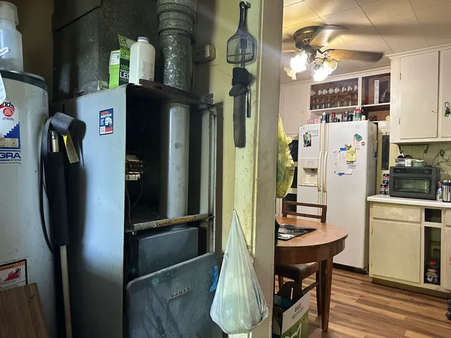 a kitchen with stainless steel appliances a refrigerator and a stove