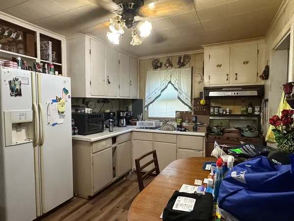 a kitchen with stainless steel appliances granite countertop a sink and cabinets