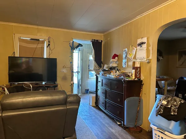 a room with furniture and a flat screen tv