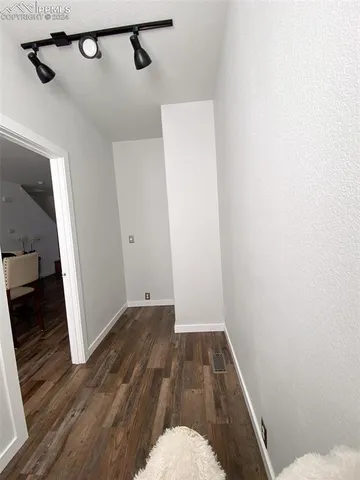 a living room with a hardwood floor